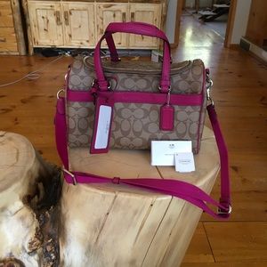 COACH signature raspberry train case. 